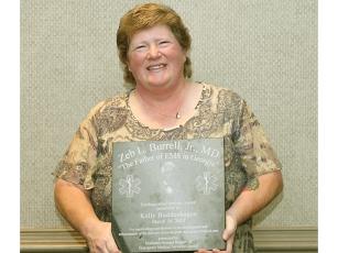 Former Gilmer County firefighter/paramedic Kelly Buddenhagen holds the Dr. Zeb L. Burrell Jr. Distinguished Service Award, which she recently received from the Georgia EMS Association. The award recognizes outstanding contributions to the development and/or enhancement of the delivery of EMS care.