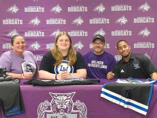 Gilmer High state champion Taylor Schiesser, second from left, will attend Lindsey Wilson College, Ky., and wrestle for the Blue Raiders. Joining Schiesser from left are, parents Diane and Dax Schiesser and Lindsey Wilson womens head coach Devane Dodgens.