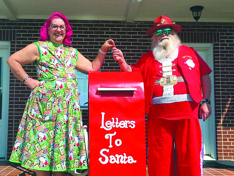 Michelle and Jon Vigue are pictured with a Santa mailbox that’s now accepting letters in front of the Gilmer Chamber’s Downtown Welcome Center.